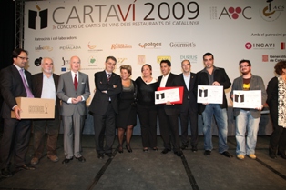 El conseller Llena amb els premiats