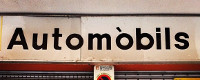 rètol amb el text automòbils